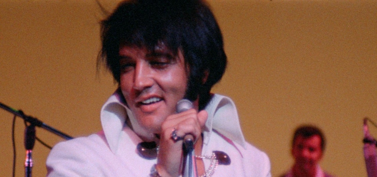 Elvis singing on stage in Epic: Elvis Presley in Concert